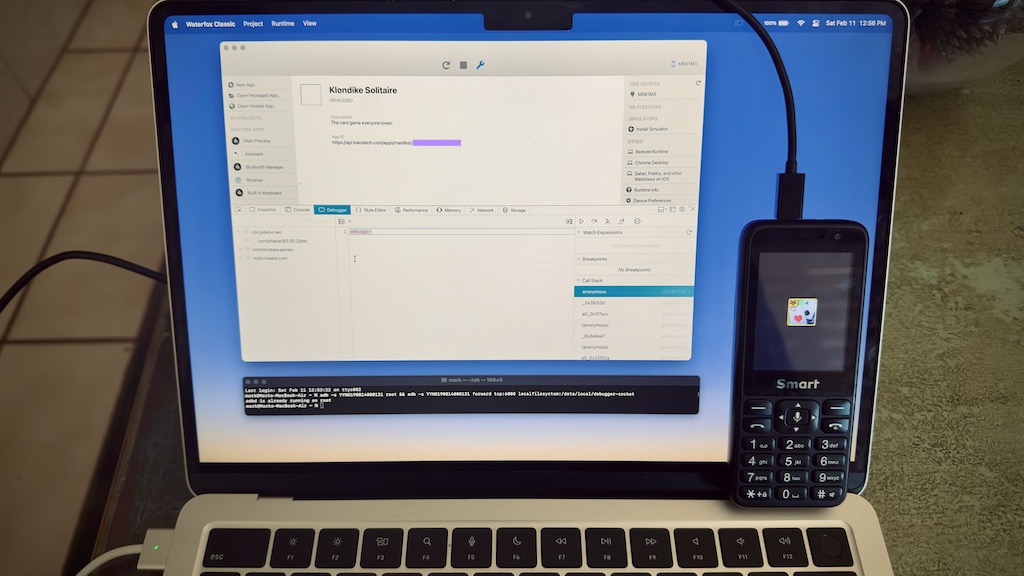 A kaios phone tethered to a MacBook Air M2 being debugged with Waterfox.
